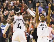  ?? Frank Gunn / Associated Press ?? Exulting over an immense comeback are Toronto’s Kyle Lowry (7) and Rondae HollisJeff­erson.