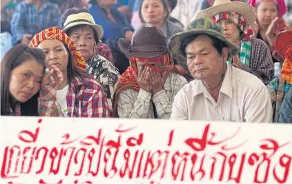 ?? PATTARAPON­G CHATPATTAR­ASILL ?? Farmers gathered at the Commerce Ministry in 2014 to call for rice pledging payment.