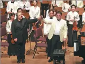  ?? PHOTOS PROVIDED TO CHINA DAILY ?? Left: Pianist Yefim Bronfman (left) and conductor Alan Gilbert at the opening concert of the Music in the Summer Air festival in Shanghai. Right: The New York Philharmon­ic plays under the baton of Gilbert.