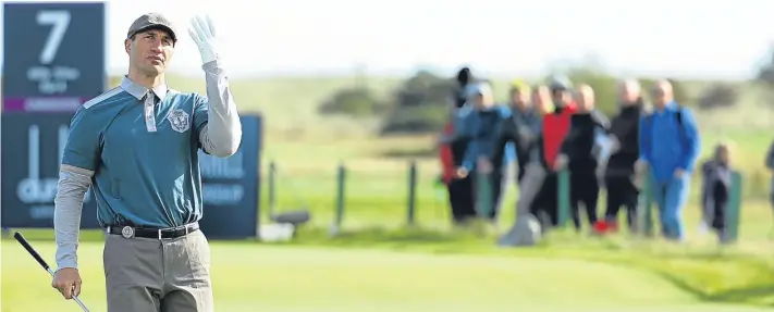  ?? Picture: Getty Images. ?? Wladimir Klitschko says golf is probably the most complicate­d sport you could choose as he takes to the greens at Carnoustie Links.