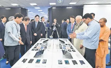  ??  ?? This handout photograph released by India’s Press Informatio­n Bureau (PIB) on July 9, shows Indian Prime Minister Narendra Modi (third right) and South Korean President Moon Jae-in (second left) attending the inaugurati­on of the world’s largest...