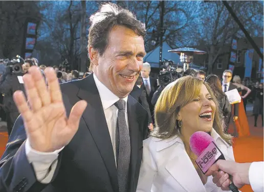  ?? Allen McInnis / montreal GAZETTE ?? PQ leadership contender Pierre Karl Péladeau and fiancée Julie Snyder arrive at a Montreal awards show in 2012. Quebec’s
Liberal government has scrapped a tax credit worth millions of dollars that had been granted to Snyder’s company.