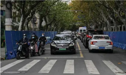  ?? Photograph: Héctor Retamal/AFP/ Getty Images ?? Barriers have been set up along a road in Shanghai where protests took place on Saturday and Sunday.