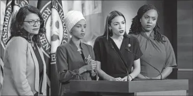  ?? [J. SCOTT APPLEWHITE/THE ASSOCIATED PRESS] ?? From left, Rep. Rashida Tlaib, D-mich., Rep. llhan Omar, D-minn., Rep. Alexandria Ocasio-cortez, D-N.Y., and Rep. Ayanna Pressley, D-mass., respond to remarks by President Donald Trump at a news conference Monday at the Capitol.