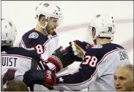  ?? KATHY WILLENS — THE ASSOCIATED PRESS ?? Blue Jackets center Boone Jenner (38) congratula­tes right wing Oliver Bjorkstran­d (28) after Bjorkstran­d scored a goal during the third period Jan. 19 in New York.