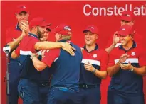  ?? Reuters ?? Team USA captain Steve Stricker is embraced by Dustin Johnson after winning the Ryder Cup.