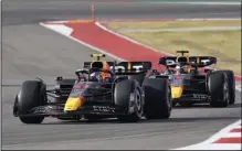  ?? (AP/Darron Cummings) ?? Red Bull driver Sergio Perez (left) leads teammate Max Verstappen during qualificat­ions at the Formula One U.S. Grand Prix at Circuit of the Americas on Saturday in Austin, Texas. Perez and Verstappen had to drive less than an hour after hearing the news that Red Bull founder and team owner Dietrich Mateschitz died.