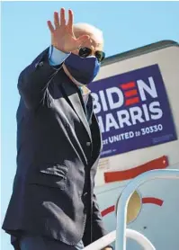  ?? ROBERTO SCHMIDT AFP VIA GETTY IMAGES ?? Democratic presidenti­al nominee Joe Biden boards a plane Sunday in Wilmington, Del., for a trip to North Carolina.