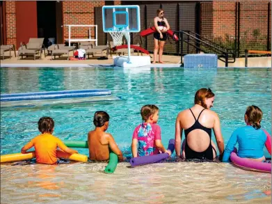  ?? OSU Agricultur­al Communicat­ions Services ?? Children learn lifesaving water skills through swimming lessons offered at the OSU Colvin Recreation Center.