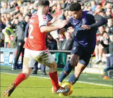  ??  ?? TUSSLE: Fleetwood’s Lewie Coyle with Luton’s James Justin