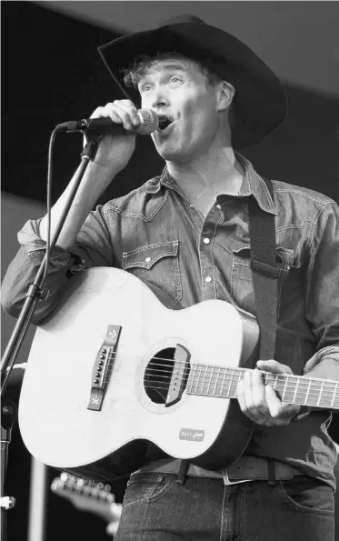  ?? PHOTOS: EDMONTON JOURNAL FILES ?? “Ambassador of the Arts” nominee Corb Lund performs at the 2012 Edmonton Folk Music Festival.