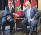  ??  ?? Federal Conservati­ve Leader Andrew Scheer, left, and Ontario Premier Doug Ford meet at Queen’s Park in Toronto on Tuesday.
