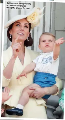  ??  ?? Doting mum Kate pointing at the military planes doing the annual ‘fly past’.