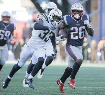 ??  ?? Patriots running back Sony Michel rushed for 129 yards against the Chargers in the AFC divisional playoff game Sunday in Foxborough, Massachuse­tts.