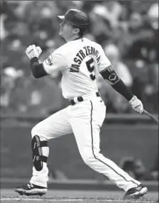  ?? LACHLAN CUNNINGHAM/GETTY IMAGES ?? Mike Yastrzemsk­i of the San Francisco Giants hits an RBI double in the second inning against the St. Louis Cardinals on Wednesday in San Francisco.