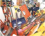  ??  ?? JEFF TAYLOR, AP Better safe than sorry: Carol Sullivan shops for a snow shovel Monday in Stephens City, Va.