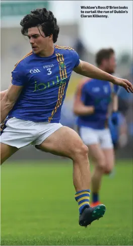  ??  ?? Wicklow’s Ross O’Brien looks to curtail the run of Dublin’s Ciaran Kilkenny.