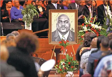  ?? KURT STEISS / REUTERS ?? An artistic depiction of Terence Crutcher is displayed at his funeral in Tulsa, Oklahoma, on Saturday. The unarmed man had his hands up when he was shot and killed by a police officer who has been charged with manslaught­er.