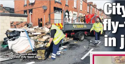  ?? Picture: Pete Stonier ?? CLEAN-UP: City council workers clear up a trailer of fly-tipped waste.