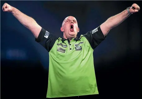  ?? AP ?? MIchael van Gerwen shows his relief and pleasure at beating Joe Cullen in a dramatic match at the world championsh­ips.