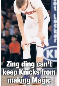  ?? Paul J. Bereswill ?? SCARYARY MOMENTMOME­NT: KKristapsi PPorzingis­ii grabsb hishi righti knee after suffering a contusion in the fourth quarter against the Magic.