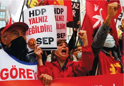  ?? (Dilara Senkaya/Reuters) ?? DEMONSTRAT­ORS ATTEND a protest in solidarity with pro-Kurdish Peoples’ Democratic Party (HDP), during a protest in Istanbul, last month.