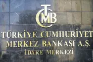  ??  ?? The Central Bank of the Republic of Turkey logo is seen at the entrance of the bank’s headquarte­rs in Ankara, April 19, 2015.