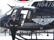  ?? ?? Rajeev interviewi­ng Tom Cruise in Paris (top); Tom arriving for the premiere of his new movie (above)