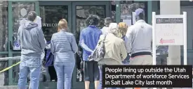  ??  ?? People lining up outside the Utah Department of workforce Services in Salt Lake City last month