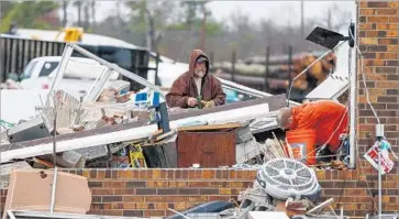  ?? Butch Dill Associated Press ?? A TORNADO tore through Rosalie, Ala. “We don’t usually get tornadoes this time of year,” said a police official in Jackson County, Ala., where 50 buildings were damaged. “But this has not been a normal weather year.”
