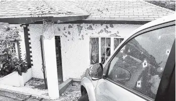  ?? FILE PHOTOS ?? The bullet-riddled house and vehicle at the Kirkland Heights home of Keith Clarke.