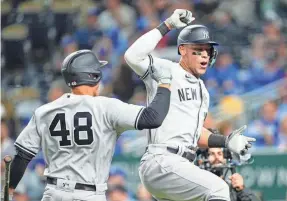  ?? JAY BIGGERSTAF­F/USA TODAY SPORTS ?? The Yankees’ Aaron Judge celebrates a home run against the Royals with Anthony Rizzo.