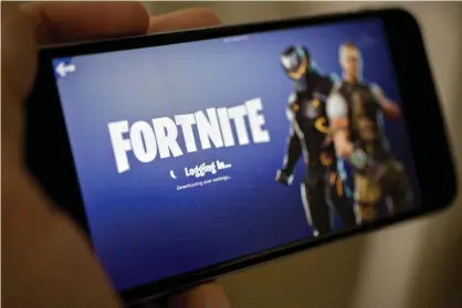  ?? Photograph: Bloomberg/Bloomberg via Getty Images ?? Apple removed the video game Fortnite from its App Store Thursday.