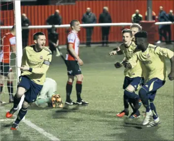  ?? Picture: Les Biggs ?? Tom Bryant wheels away after scoring Whitstable’s second goal during their 2-2 draw at Sheppey on Tuesday night