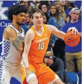  ?? AP PHOTO BY JAMES CRISP ?? Tennessee redshirt junior forward John Fulkerson backs up Kentucky’s Nick Richards during the first half of Tuesday night’s game in Lexington, Ky.