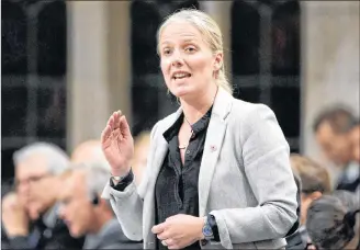  ?? CP PHOTO ?? Environmen­t and Climate Change Minister Catherine McKenna rises during question period in the House of Commons on Parliament Hill, in Ottawa on Thursday.