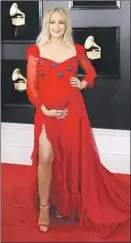  ??  ?? MARGO PRICE, expecting a child, wears a romantic red gown by Los Angeles-based designer Kimberly Parker.