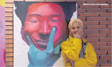  ??  ?? MINO in front of his painting.