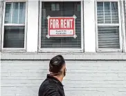  ?? Nick Otto/Special to The Chronicle 2020 ?? A pedestrian looks up at a “For Rent” sign in a window on Hayes Street in October 2020.
