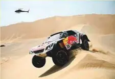  ?? AFP ?? Peugeot’s French driver Sebastien Loeb and co-driver Daniel Elena of France compete during Stage 1 of the Dakar Rally.