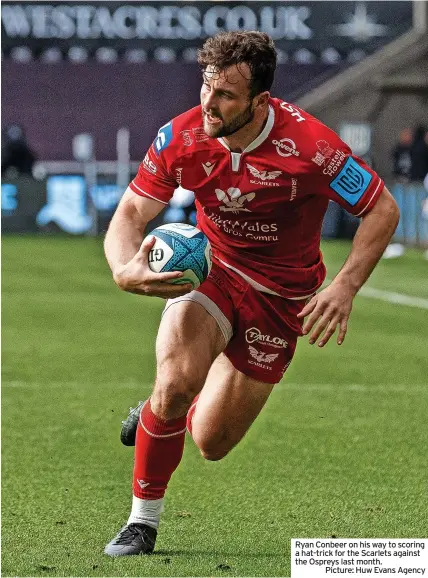  ?? ?? Ryan Conbeer on his way to scoring a hat-trick for the Scarlets against the Ospreys last month.
Picture: Huw Evans Agency
