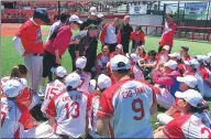  ?? PROVIDED TO CHINA DAILY ?? Beijing Shougang Eagles players listen attentivel­y as they receive direction from their coaching team.