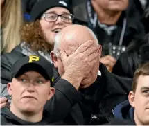  ?? GETTY IMAGES/PHOTOSPORT ?? Then-coach Graham Henry, left, and captain Richie McCaw reflect the mood of a nation after New Zealand’s shock loss to France in the quarterfin­als of the 2007 World Cup. Results such as that will keep All Blacks fans on edge leading into the showdown with Ireland in Tokyo tomorrow.