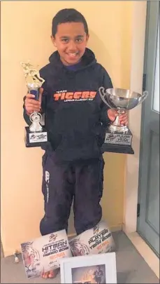  ??  ?? Rhys Puata received the Te Puke Tigers Under 11 Player of the Year, Tigers Hit Man and Five Season Tiger awards.