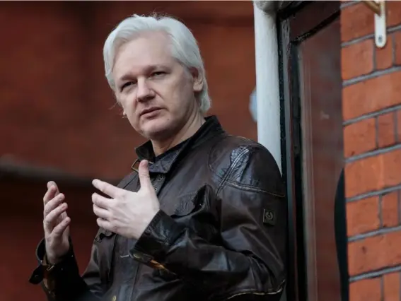  ?? (Getty) ?? New terms require the WikiLeaks founder to pay for medical bills and calls