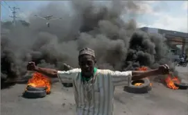  ?? Clarens Siffroy/ AFP via Getty Images ?? A demonstrat­ion following the resignatio­n of Haitian Prime Minister Ariel Henry on March 12.