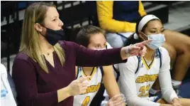  ?? STAFF PHOTO BY MATT HAMILTON ?? UTC women’s basketball coach Katie Burrows instructs her team during this past Sunday’s season-opening loss to UAB at McKenzie Arena. The Mocs fell to 0-2 with a 95-74 defeat at Troy on Wednesday.