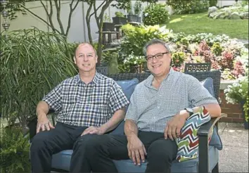  ??  ?? Joe Kotelnicki, left, and Michael O'Brien on their new back patio.