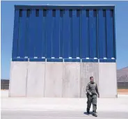  ?? CAROLYN VAN HOUTEN/THE WASHINGTON POST ?? Public Affairs Officer Vincent Pirro looks at border wall prototypes in San Diego in April. Republican lawmakers are increasing­ly disenchant­ed with plans for the barrier.