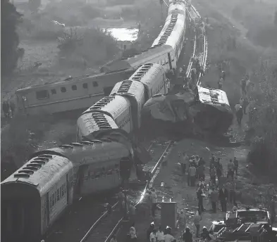  ?? RAVY SHAKER / THE ASSOCIATED PRESS ?? The wreckage of two trains that collided is seen just outside of the Mediterran­ean port city of Alexandria, Egypt, Friday. Dozens were killed and over 100 injured in the country’s deadliest rail accident in more than a decade.